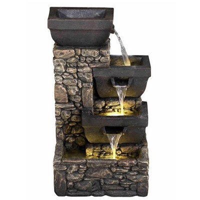 Water fountain with solar bowls on stone wall